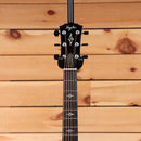 Taylor 814e Gold Label acoustic-electric guitar Natural with ebony fretboard and floral inlays on black headstock