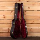 Taylor Legacy 810e Special Edition Heritage Burst hardshell guitar case open showing burgundy velvet interior with gold latch