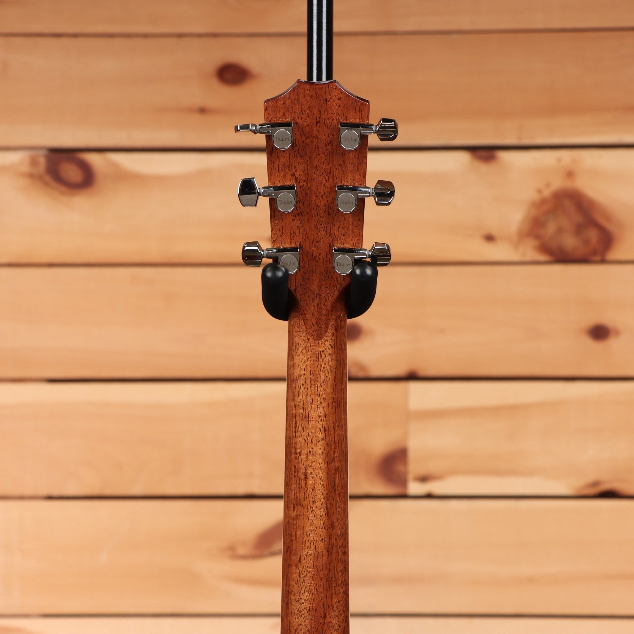 Taylor Legacy 810e Special Edition Heritage Burst acoustic-electric guitar rear headstock view with mahogany neck and chrome