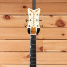 Gretsch G6134T-58 Vintage Select '58 Penguin Vintage White hollowbody guitar headstock with gold tuners and orange sparkle in