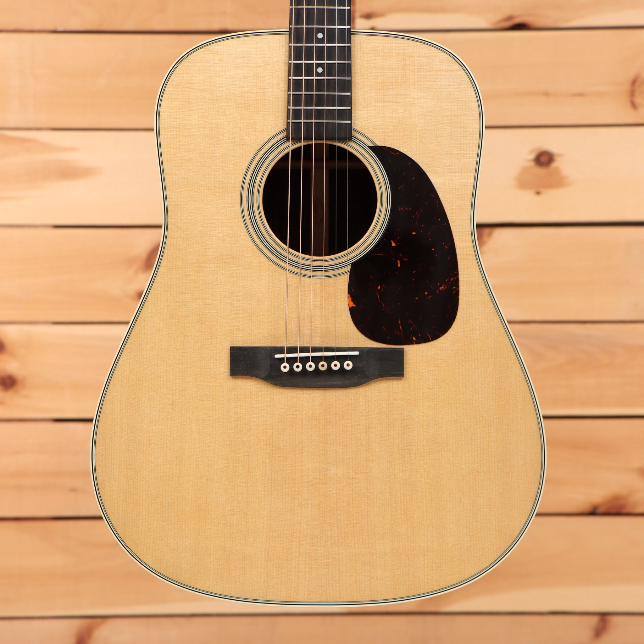 Martin D-28 dreadnought acoustic guitar Aging Toner finish with spruce top tortoise pickguard and ebony fretboard