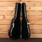Martin D-28 Aging Toner dreadnought acoustic guitar hardshell case open showing green interior and chrome latches