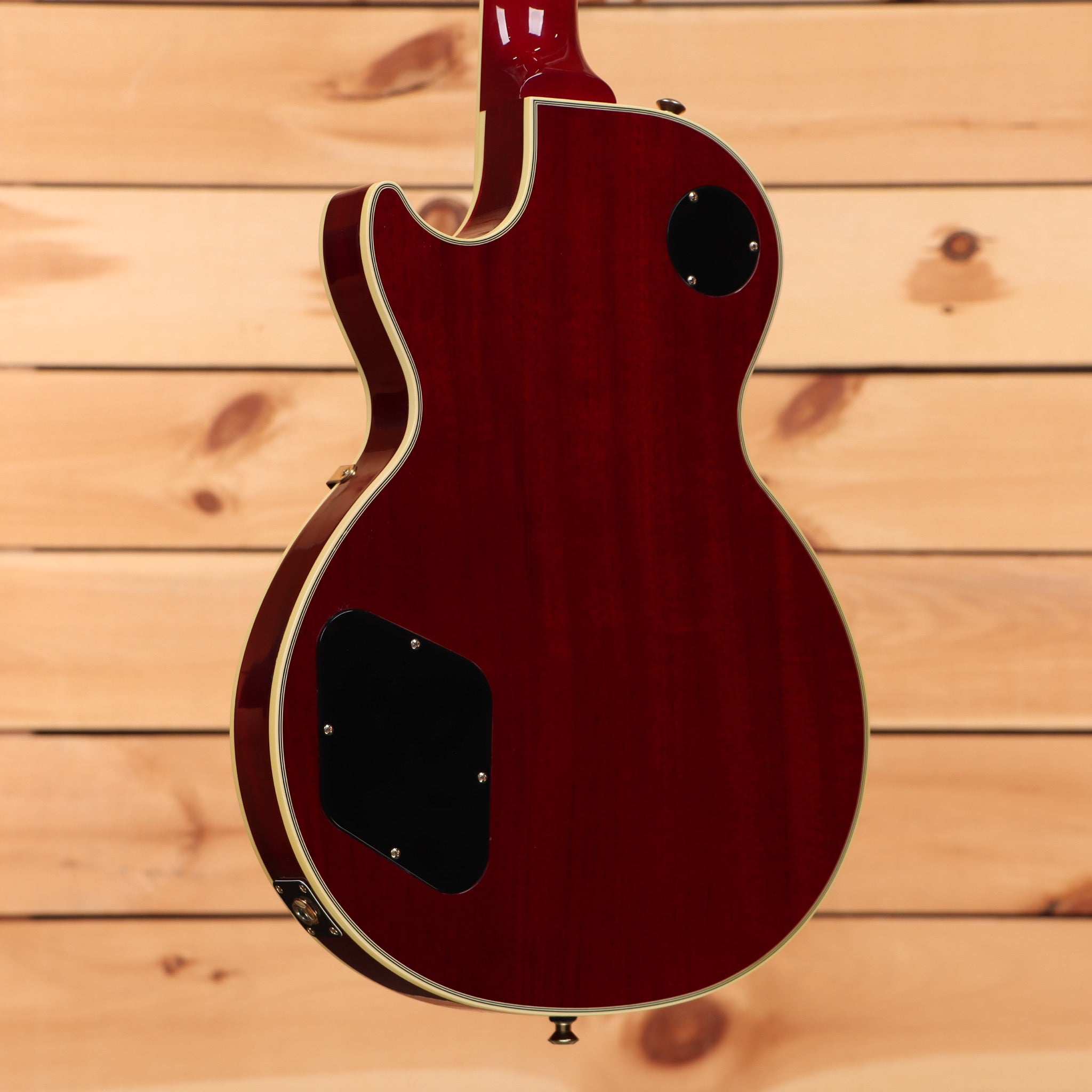Gibson 68 Les Paul Custom Figured Tri-Burst electric guitar back view with cream binding and mahogany body