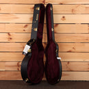 Gretsch G6136T-59 Vintage Select '59 Falcon hardshell guitar case open showing burgundy velvet interior with gold hardware