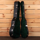 Bourgeois Downeast Slope D acoustic guitar hardshell case open showing black exterior and green velvet interior lining