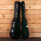 Bourgeois Downeast Slope D acoustic guitar hardshell case open showing black exterior and green velvet interior lining