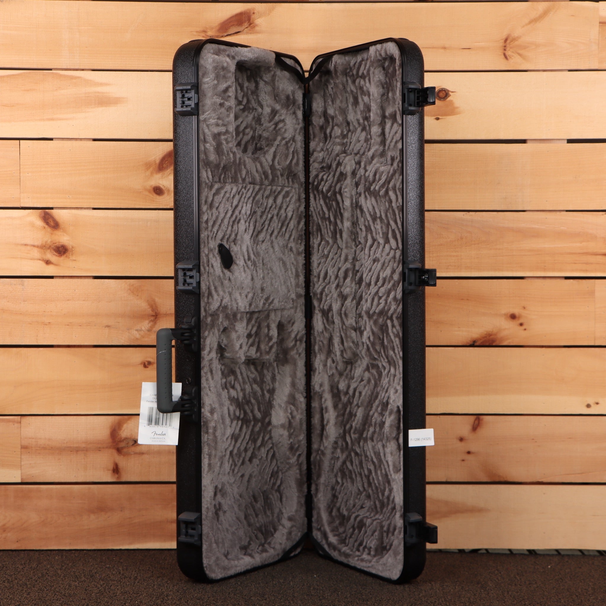 Fender American Ultra II Telecaster hard shell case open showing gray plush interior with molded black exterior