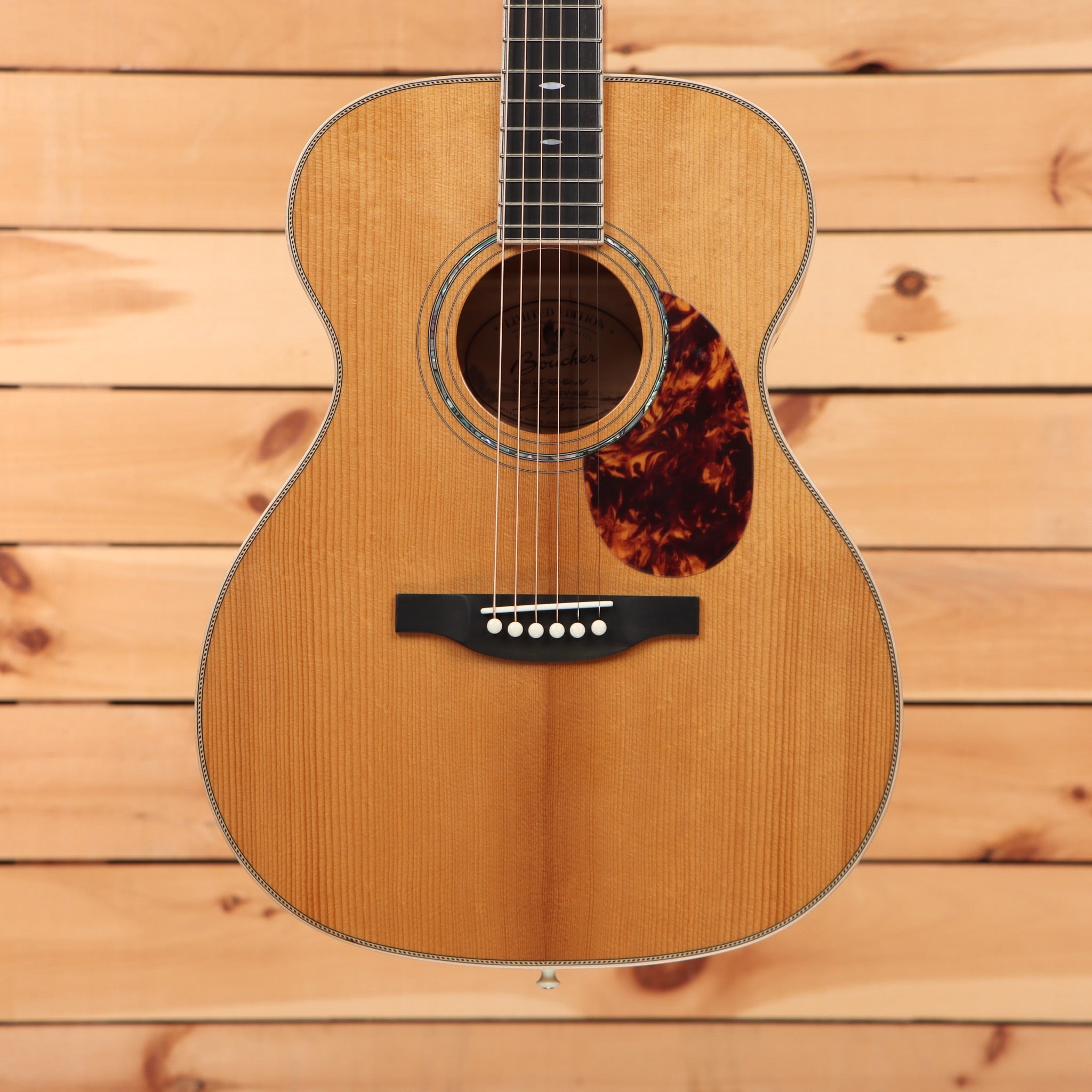 Boucher Limited LE-SG-161-MV acoustic guitar Natural finish with spruce top, tortoise pickguard, and herringbone body binding