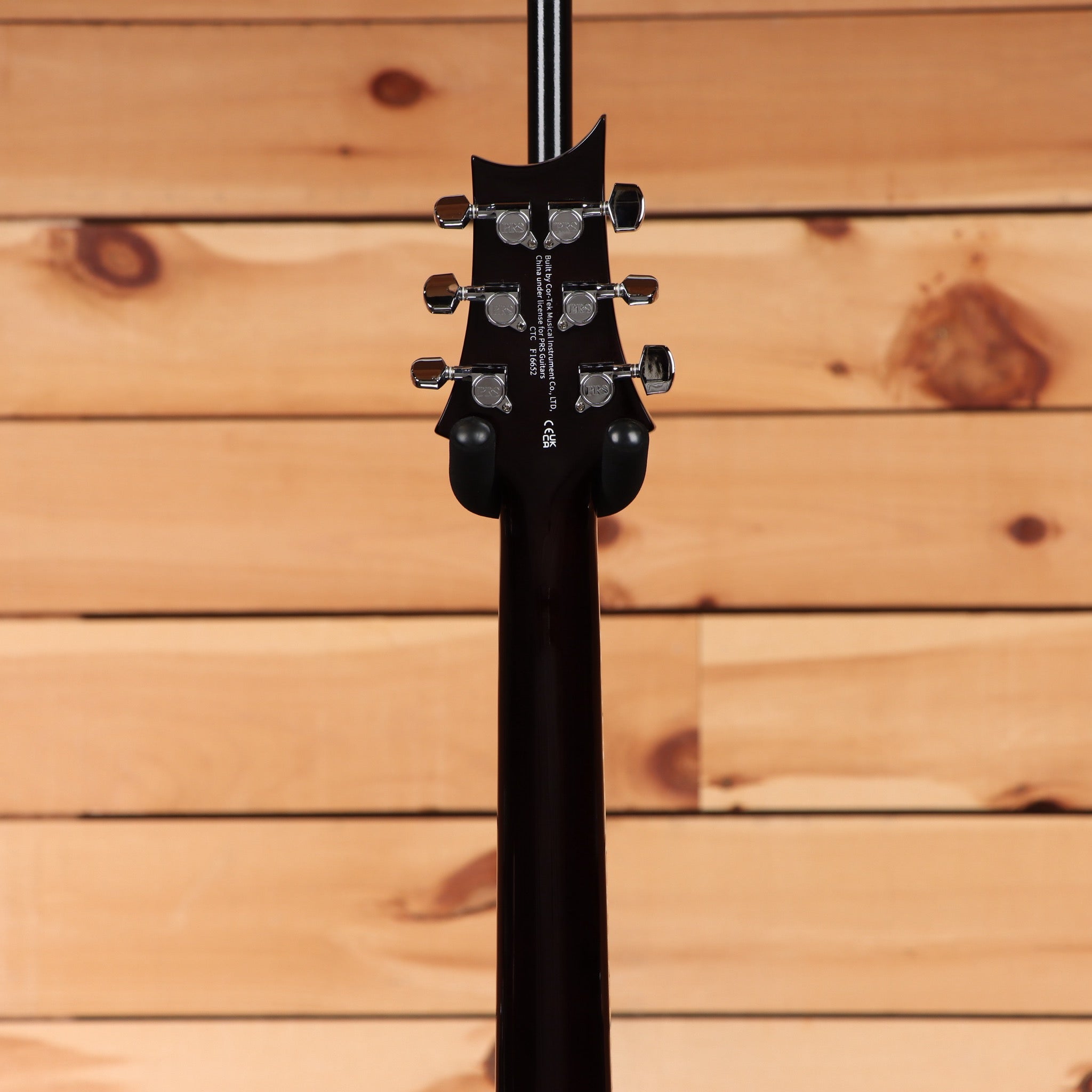 PRS SE Hollowbody Piezo electric guitar Black Gold Burst back headstock view with chrome tuners