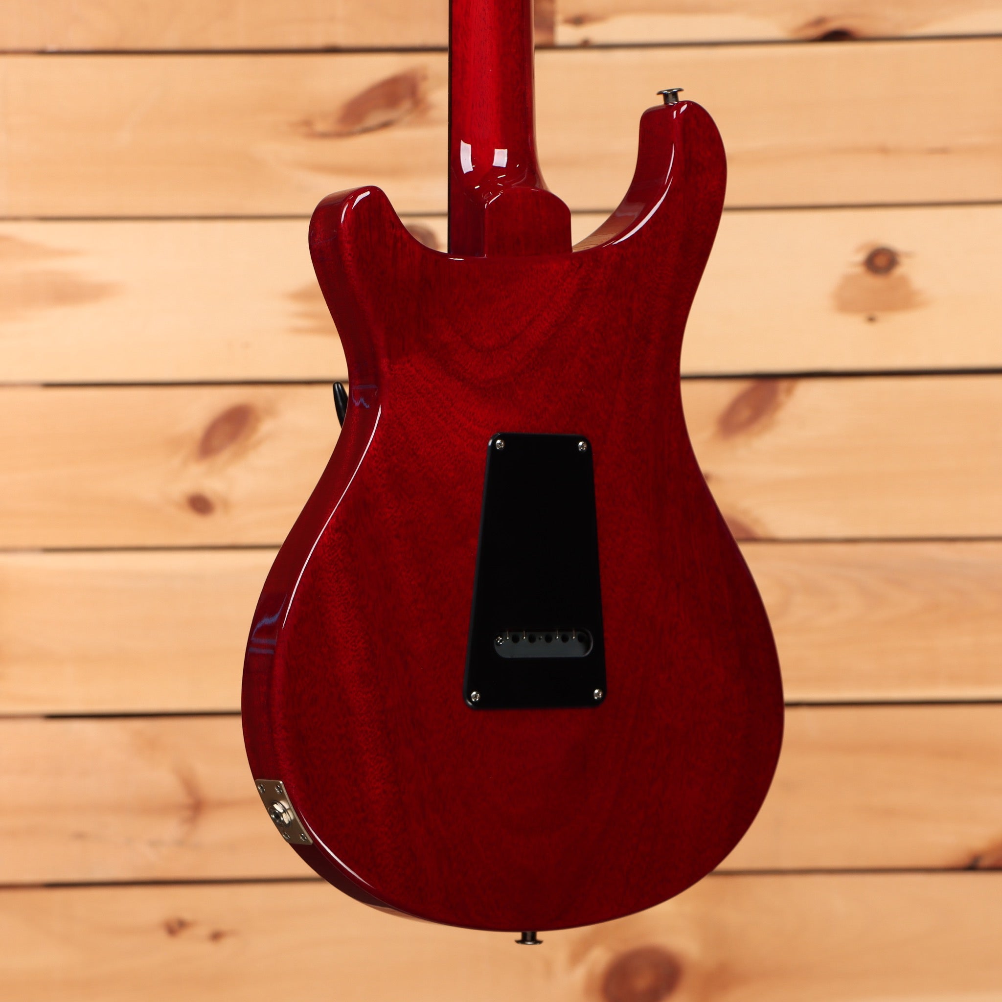 PRS S2 Standard 22 electric guitar Vintage Cherry showing mahogany back with black electronics cavity cover