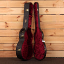 Taylor 814ce Next Generation guitar hardshell case open showing black exterior red velvet interior with gold hardware latches