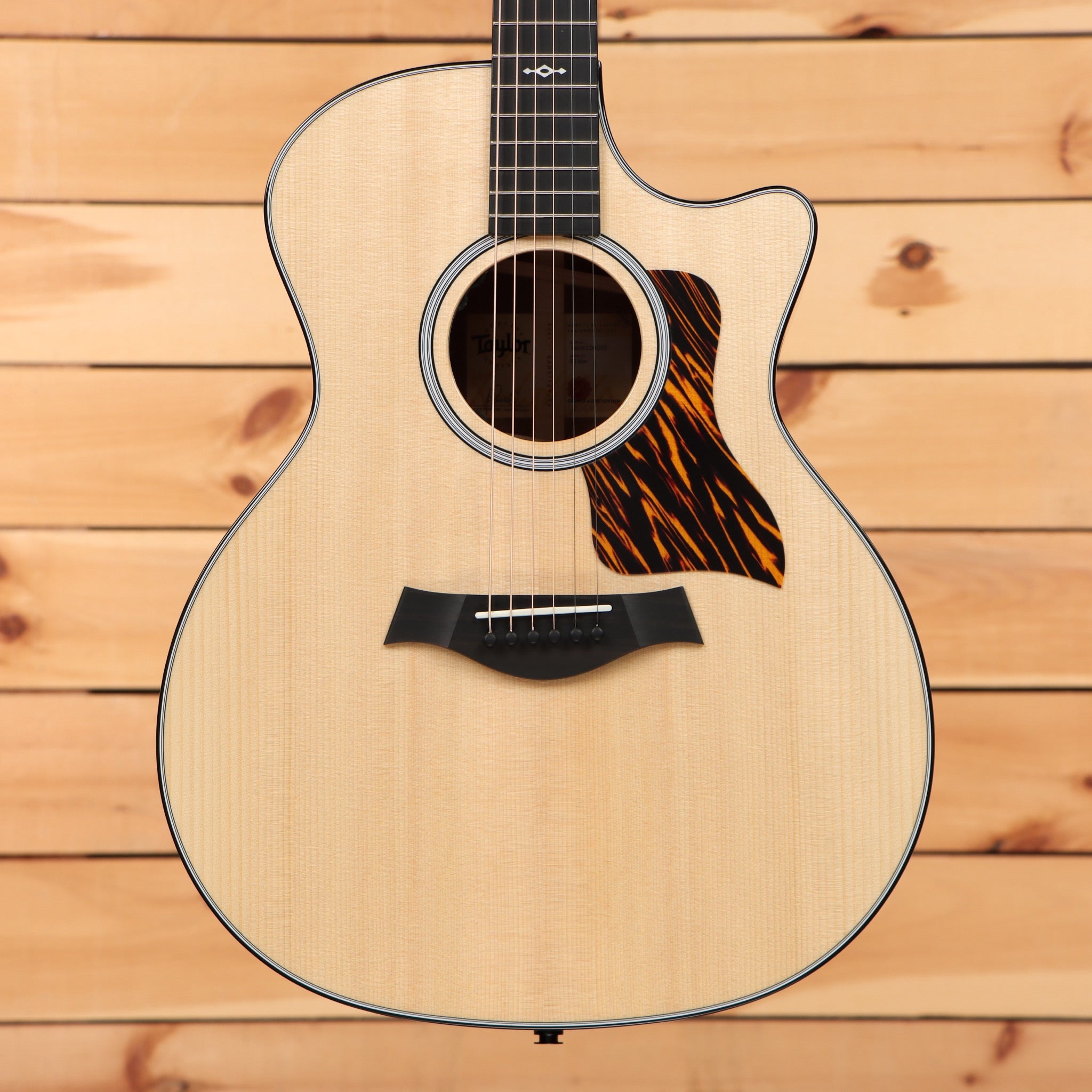 Taylor 314ce Next Generation acoustic-electric guitar Natural spruce top with venetian cutaway and striped ebony pickguard