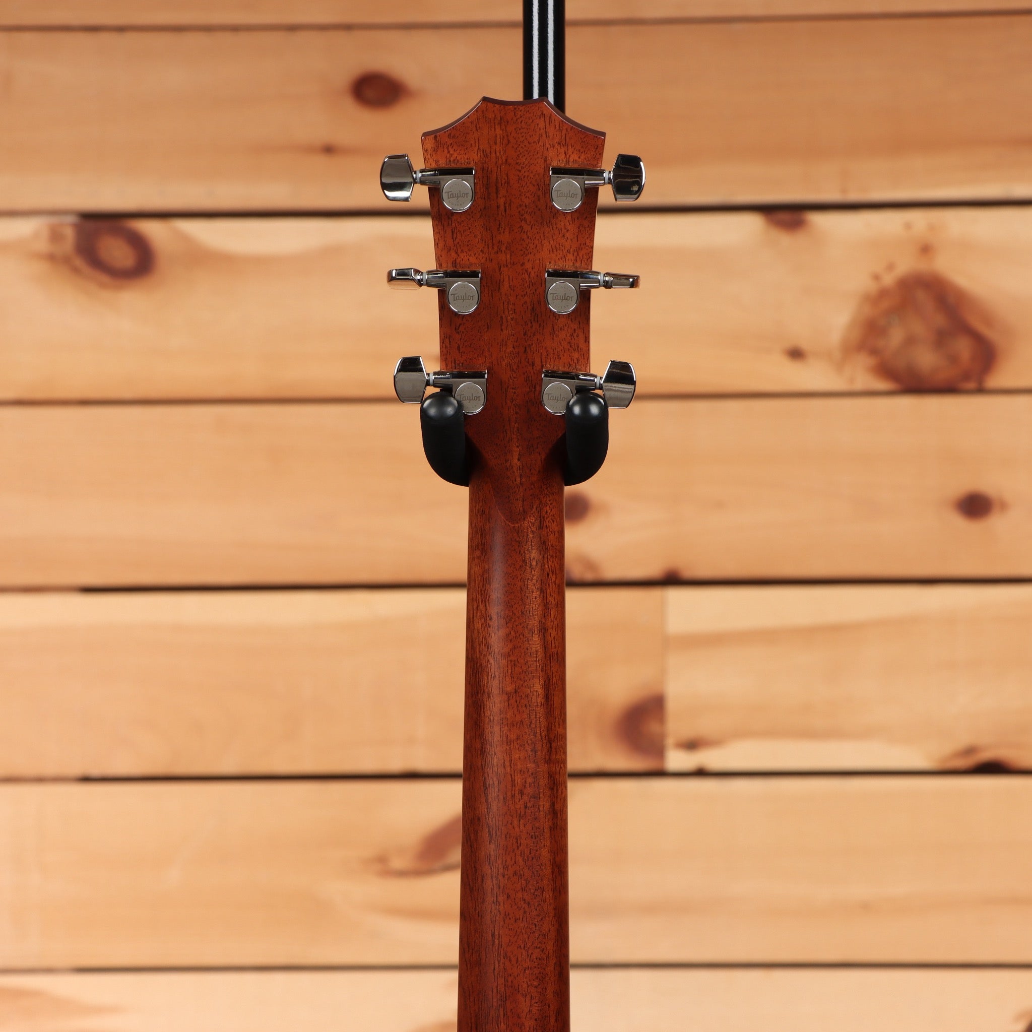 Taylor 314ce Next Generation Natural acoustic-electric guitar headstock rear view with mahogany neck and chrome Taylor tuners