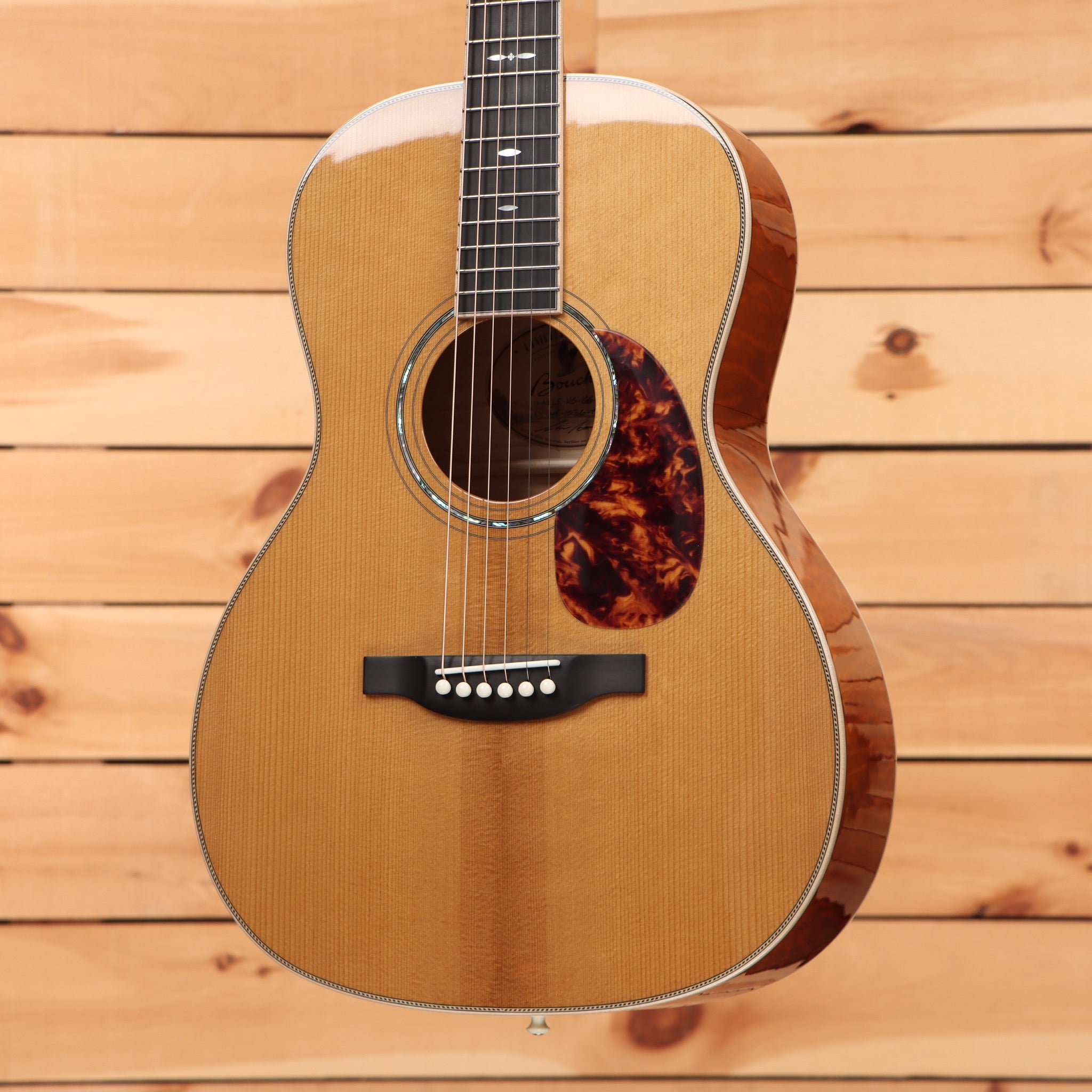 Boucher LE-HG-166-MV acoustic guitar Natural finish with spruce top, tortoise pickguard, and herringbone binding