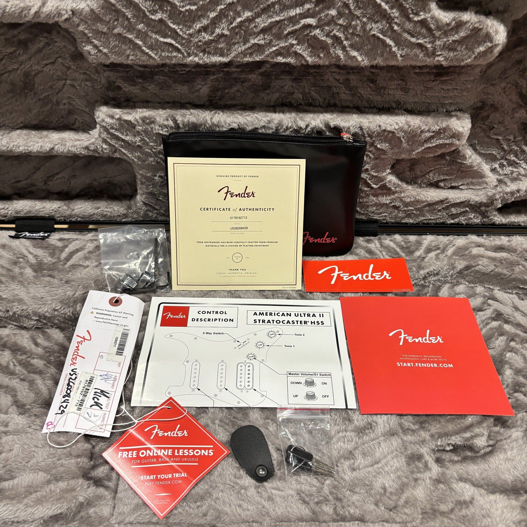 Fender American Ultra II Stratocaster HSS accessories bundle with certificate of authenticity, control diagram, tremolo arm,