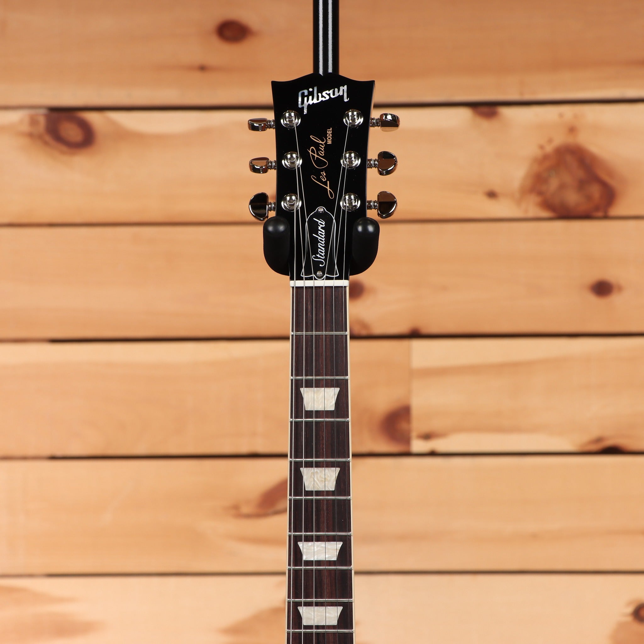 Gibson Les Paul Standard 60s Figured Top Honey Amber electric guitar headstock with rosewood fretboard and trapezoid inlays