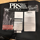PRS CE 24 Semi-Hollow electric guitar Trampas Green with included warranty card and owner's manual documentation