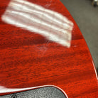 Gibson Les Paul Traditional electric guitar Heritage Cherry Sunburst mahogany body close-up showing gloss finish grain detail