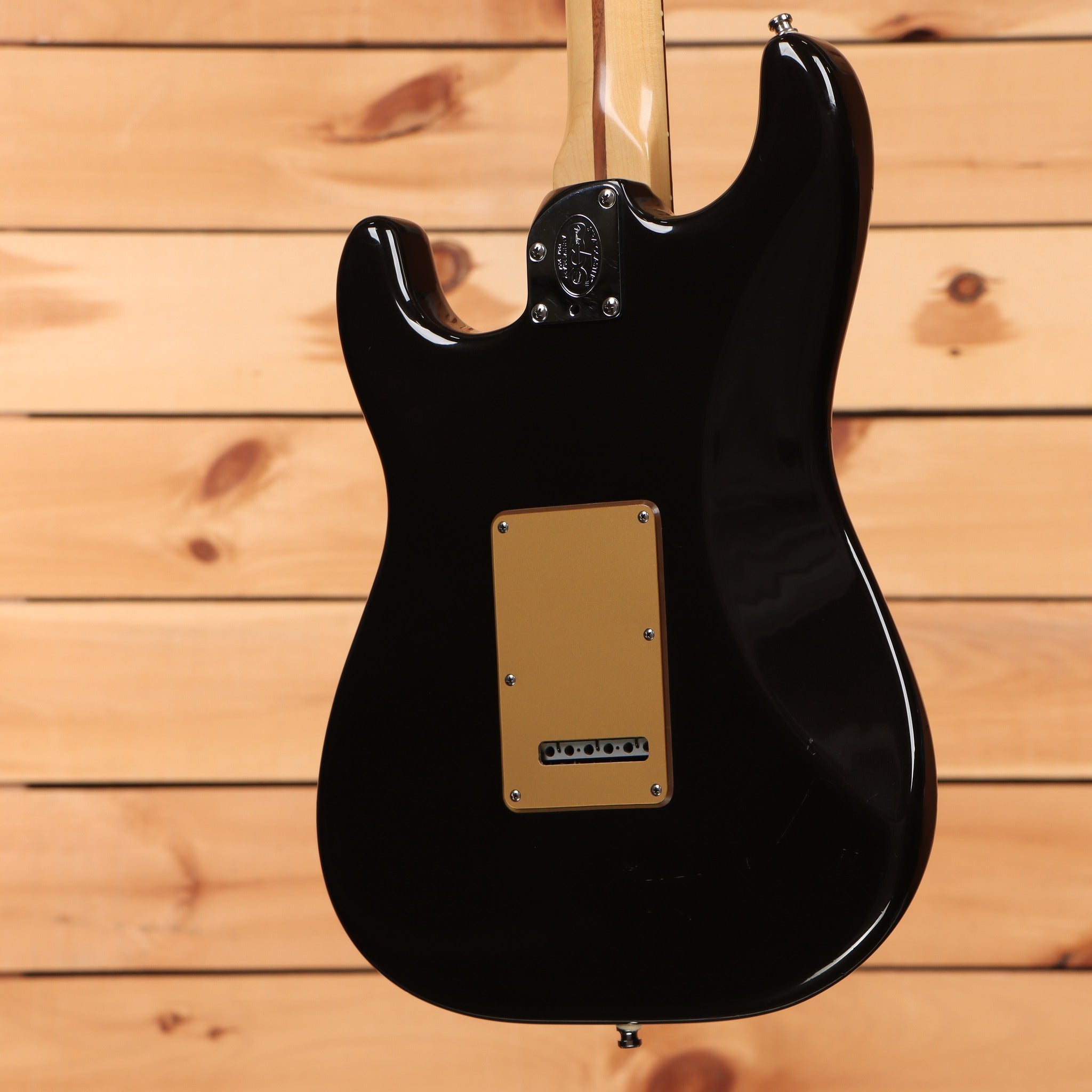 Fender American Deluxe Stratocaster HSS electric guitar Montego Black with gold back plate and maple neck