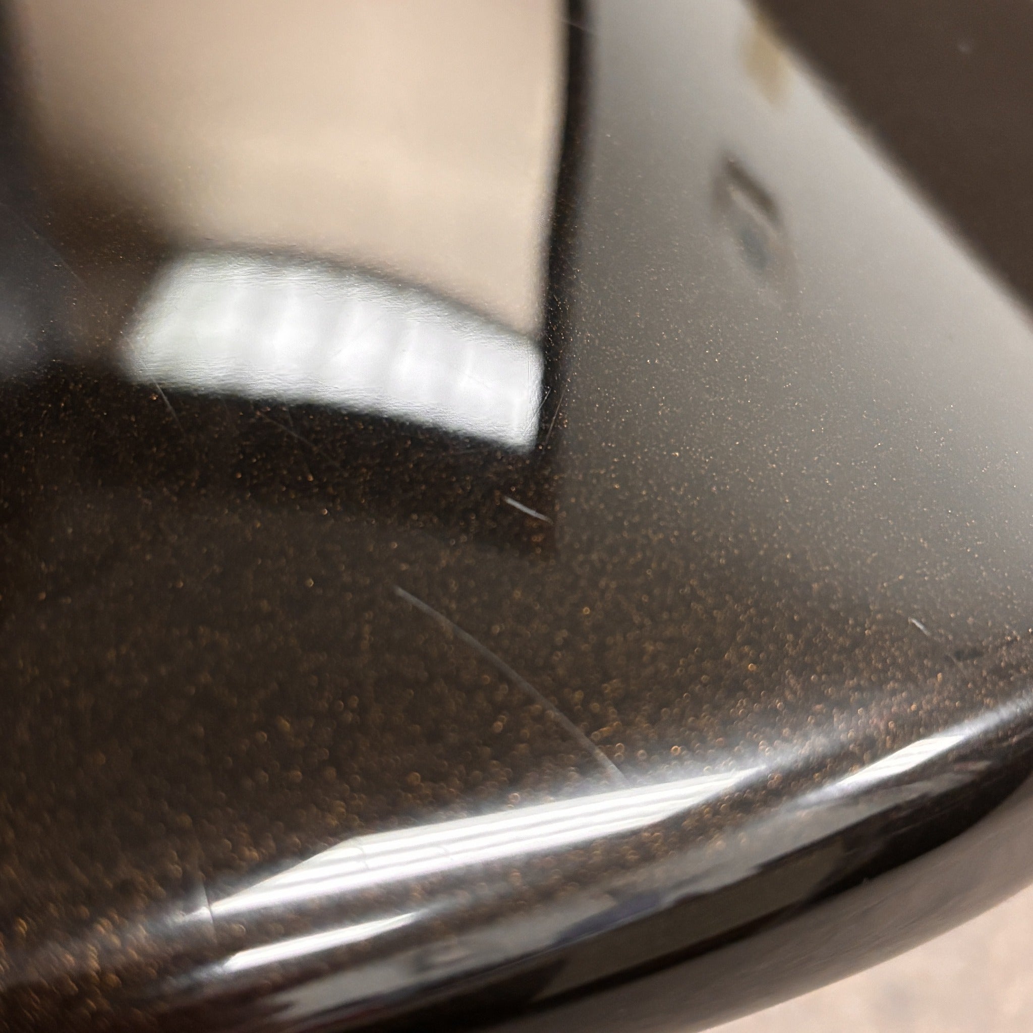 Fender American Deluxe Stratocaster HSS electric guitar Montego Black metallic finish close-up body detail