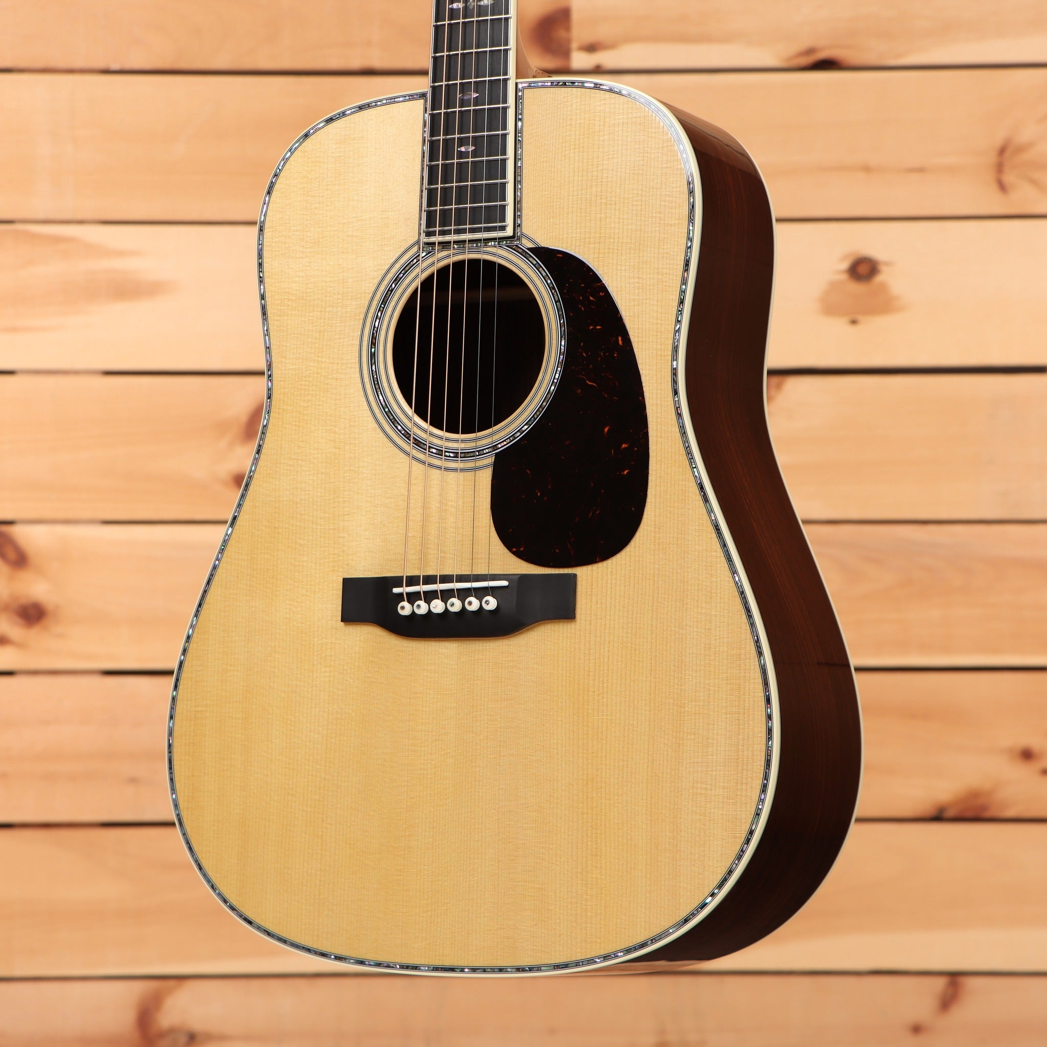 Martin D-42 dreadnought acoustic guitar Natural finish with herringbone-style binding and tortoise pickguard