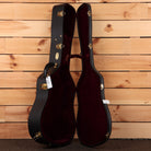 Martin D-42 acoustic guitar hardshell case black exterior with burgundy plush interior and gold hardware latches