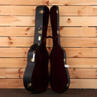 Martin D-41 Natural acoustic guitar hardshell case open showing black exterior burgundy interior and gold latches