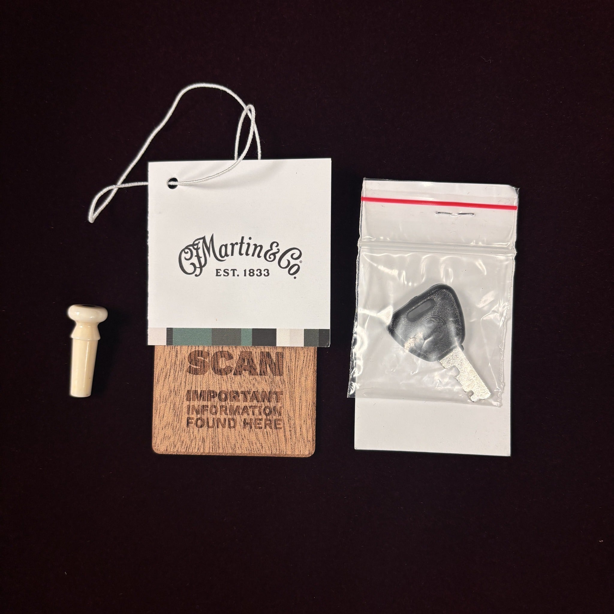 Martin D-41 Natural acoustic guitar hang tag with end pin, case key, and wood information card included accessories