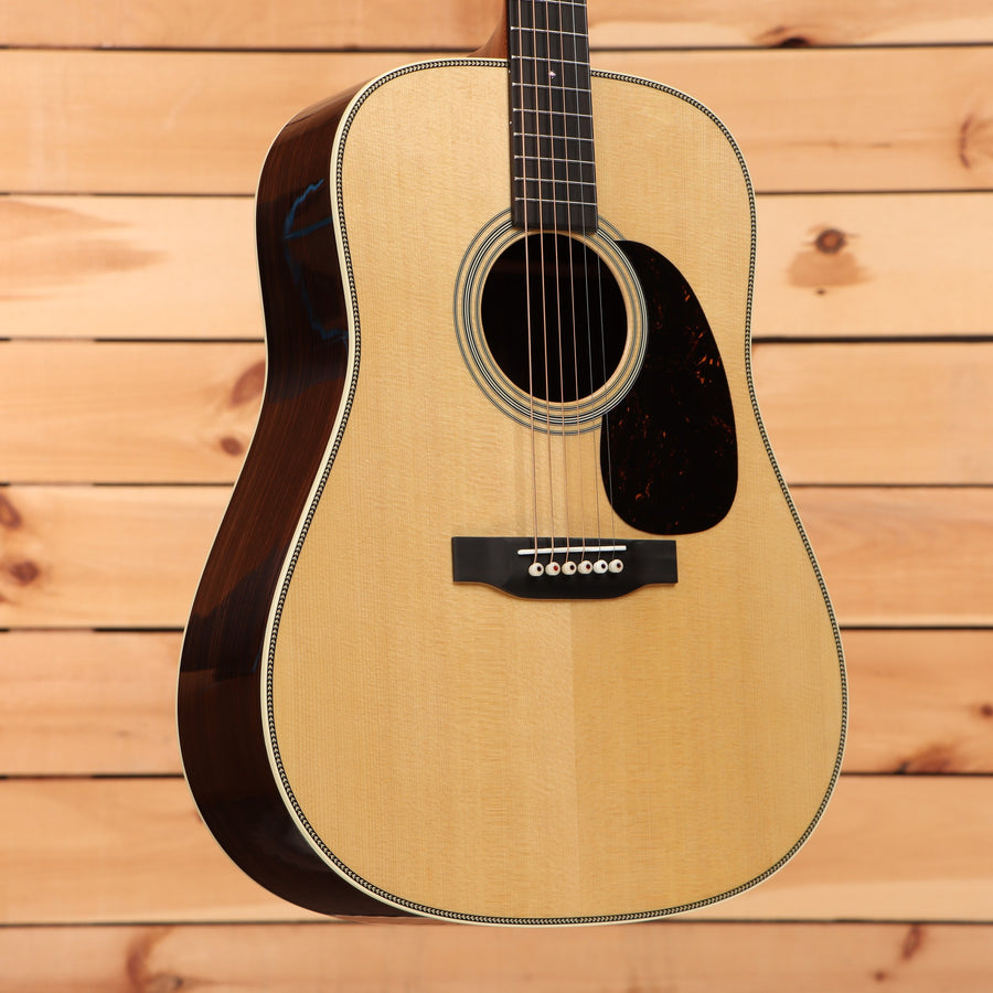 Martin HD-28 dreadnought acoustic guitar Natural with herringbone binding and tortoise pickguard