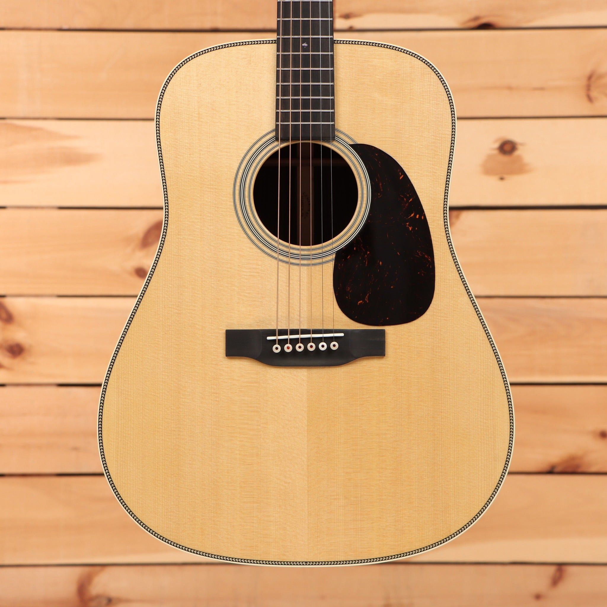 Martin HD-28 dreadnought acoustic guitar Natural with herringbone top binding and tortoise pickguard