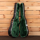 Martin HD-28 dreadnought acoustic guitar hardshell case open showing green plush interior with chrome latches