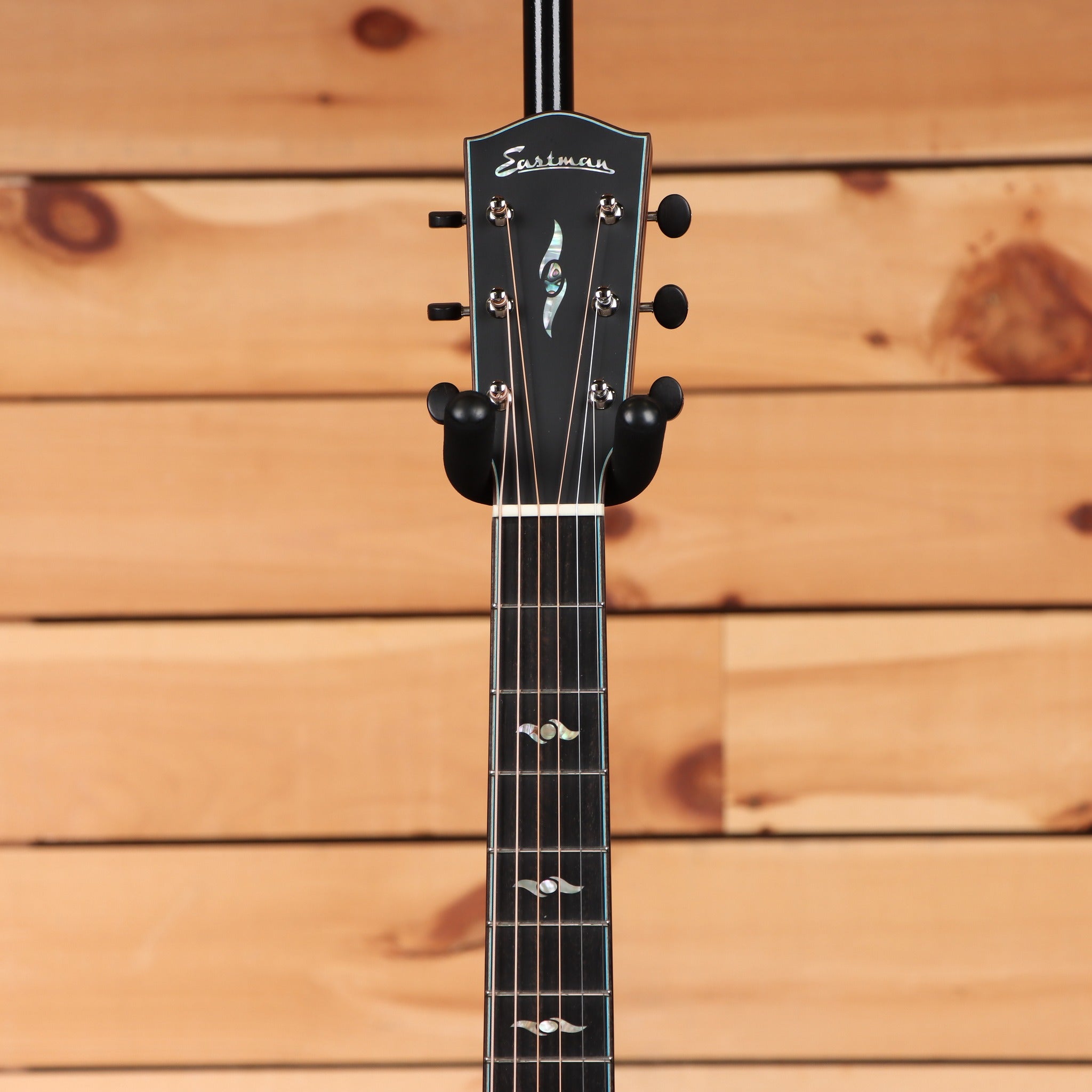 Eastman L-OMCE-QS acoustic-electric guitar Natural with ebony fretboard abalone headstock inlay and black tuners
