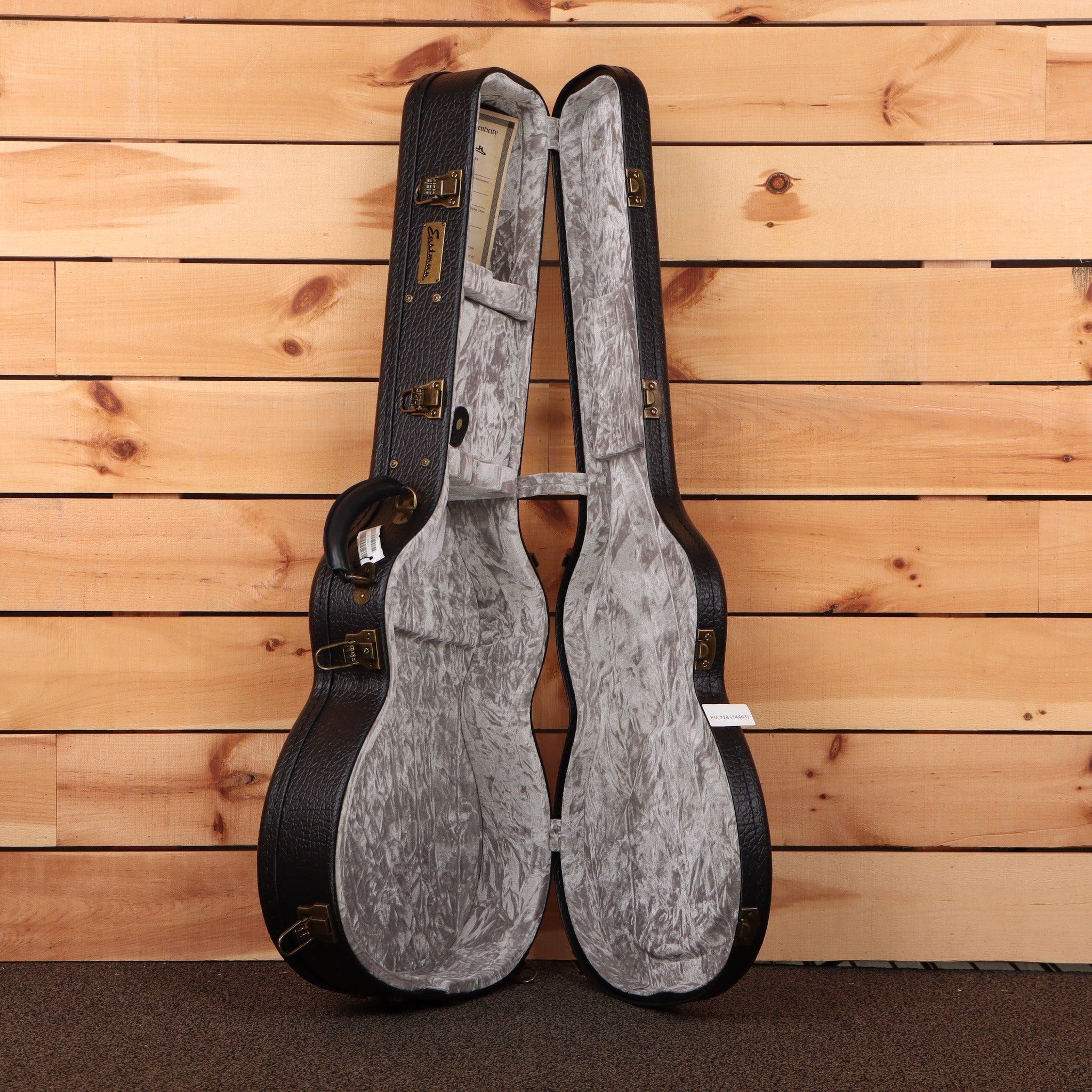 Eastman L-OMCE-QS guitar hard case open black exterior gray interior with gold hardware latches