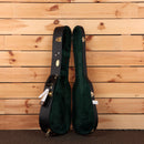 Martin 5-28 Terz guitar hardshell case open showing black exterior green velvet interior with gold hardware latches