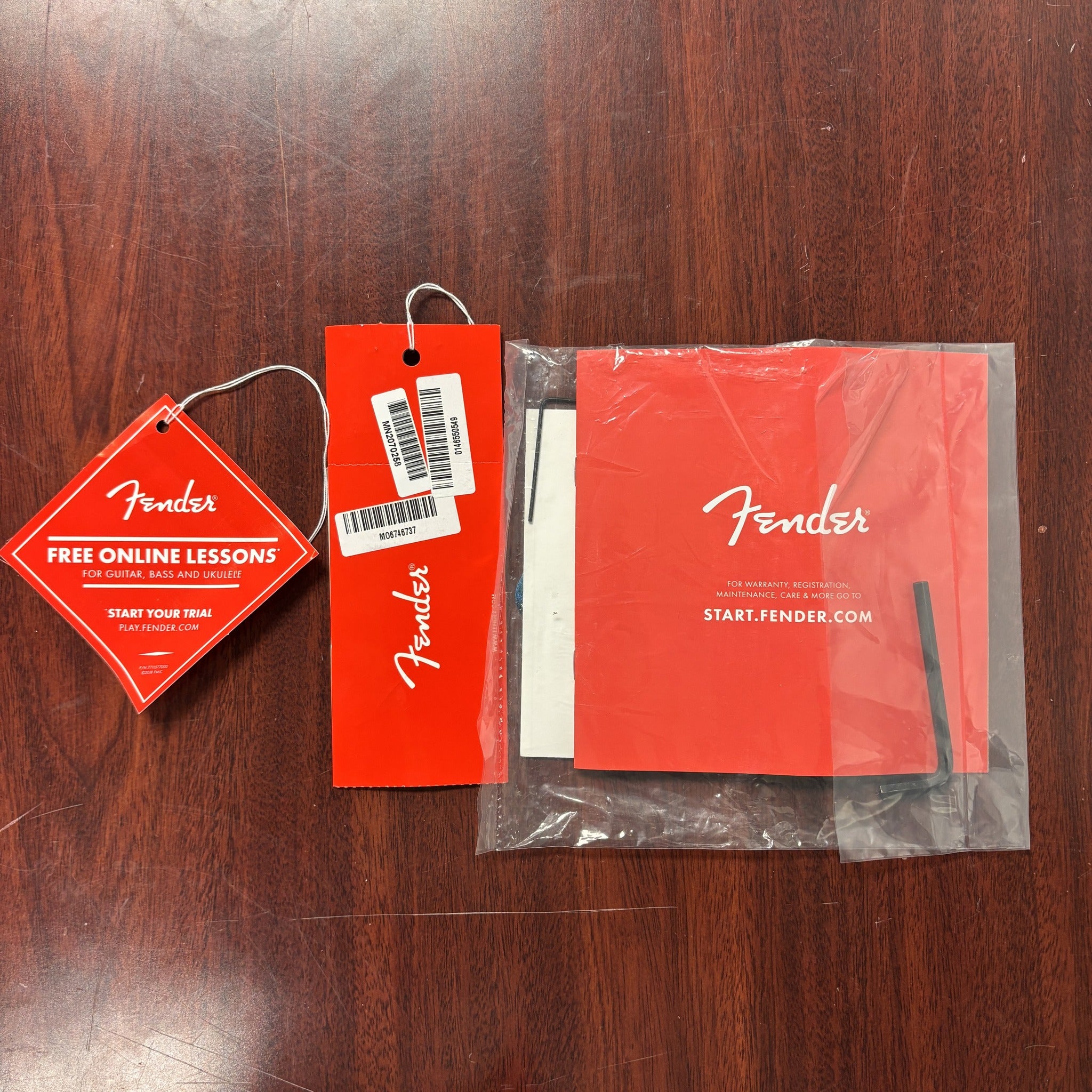 Fender 75th Anniversary Player II Telecaster Seafoam Green guitar hang tags, warranty booklet, and accessory hardware pack