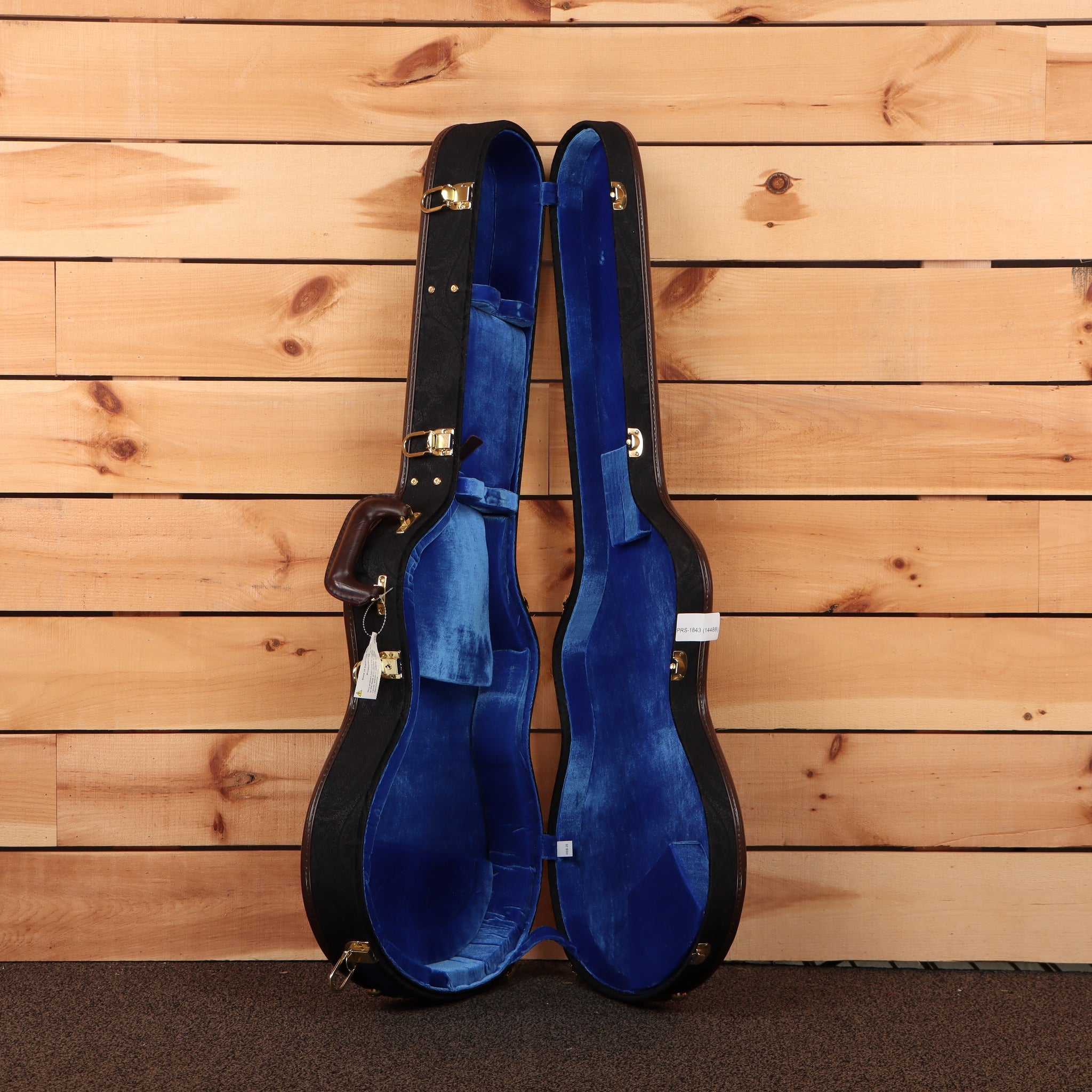 PRS McCarty 594 Hollowbody II Wood Library guitar case open showing blue velvet interior with gold hardware latches