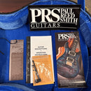 PRS McCarty 594 Hollowbody II Wood Library guitar case interior with Brazilian rosewood tag and documentation