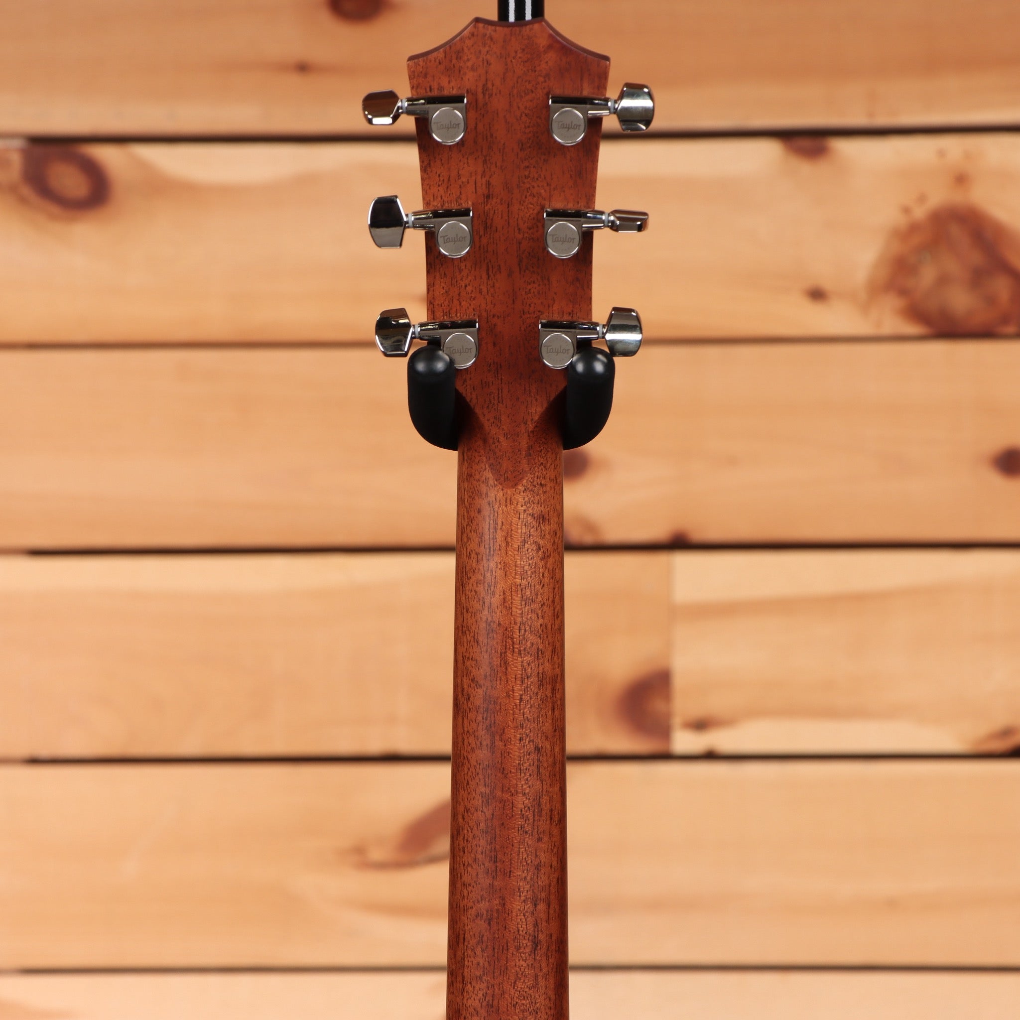 Taylor 414ce Next Generation Natural acoustic-electric guitar rear headstock view with mahogany neck and chrome Taylor tuners