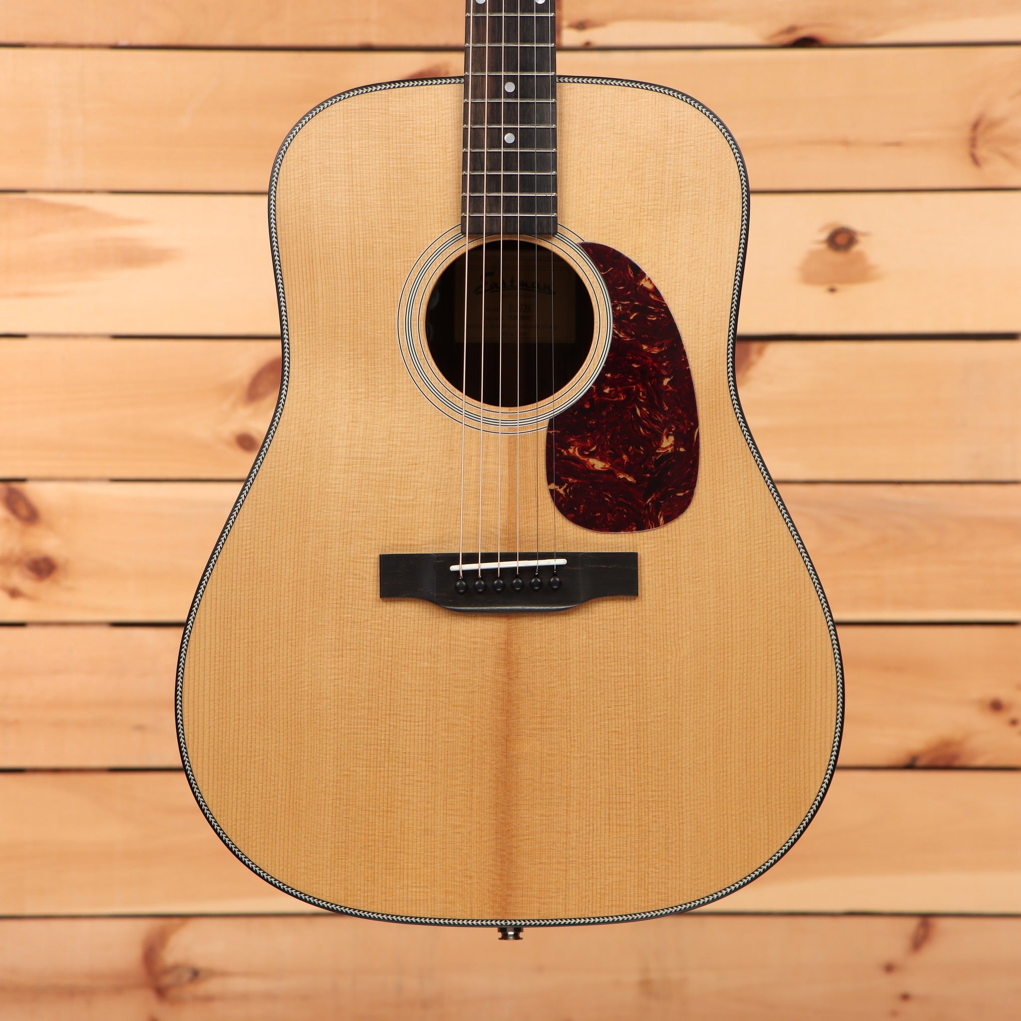 Eastman E3DE dreadnought acoustic guitar natural finish with spruce top, herringbone binding, and tortoise pickguard