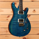 PRS Wood Library McCarty Tremolo electric guitar Arctic Blue with flamed maple top and dual humbuckers