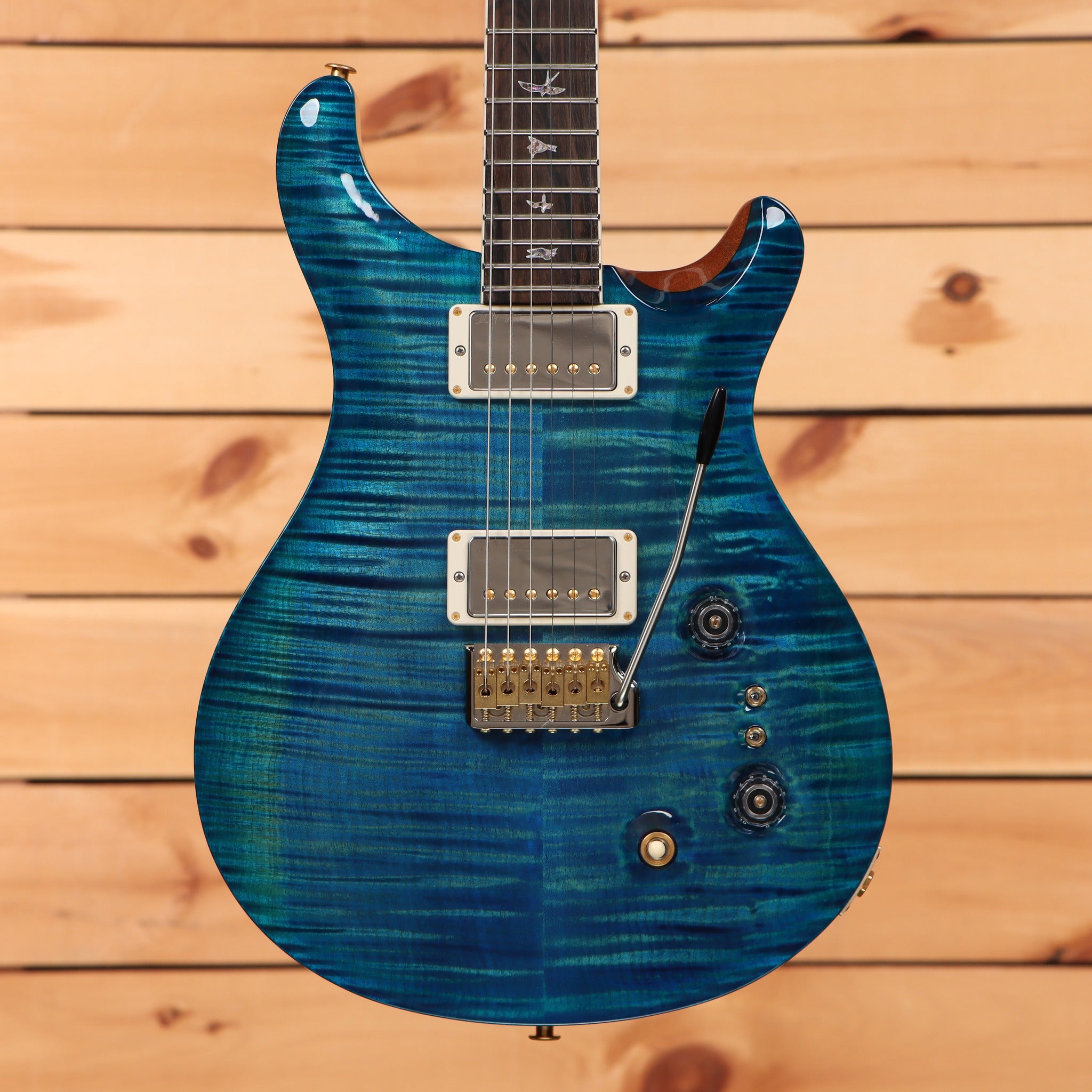 PRS Wood Library McCarty Tremolo electric guitar Arctic Blue flamed maple top with dual humbuckers and gold hardware
