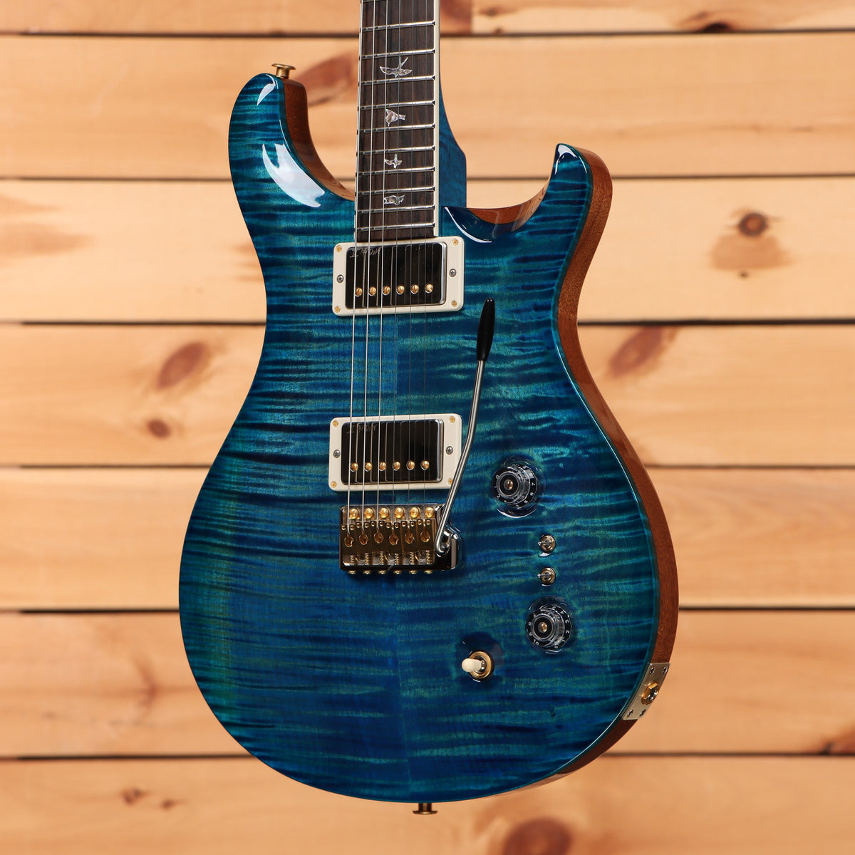 PRS Wood Library McCarty Tremolo electric guitar Arctic Blue with flamed maple top and dual humbuckers