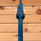 PRS Wood Library McCarty Tremolo electric guitar Arctic Blue flamed maple neck rear headstock view with gold tuners