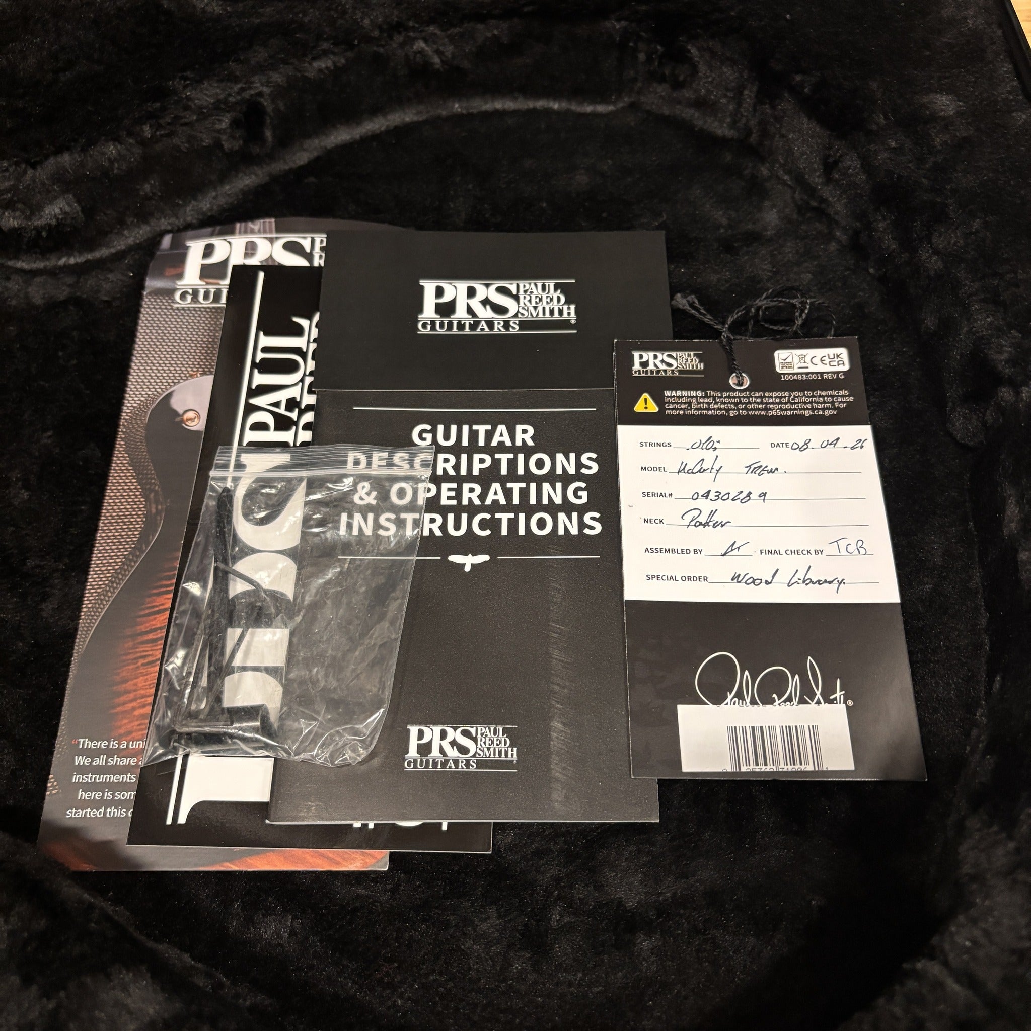 PRS Paul Reed Smith Wood Library McCarty Tremolo Arctic Blue guitar documentation package with hang tag and operating instruc