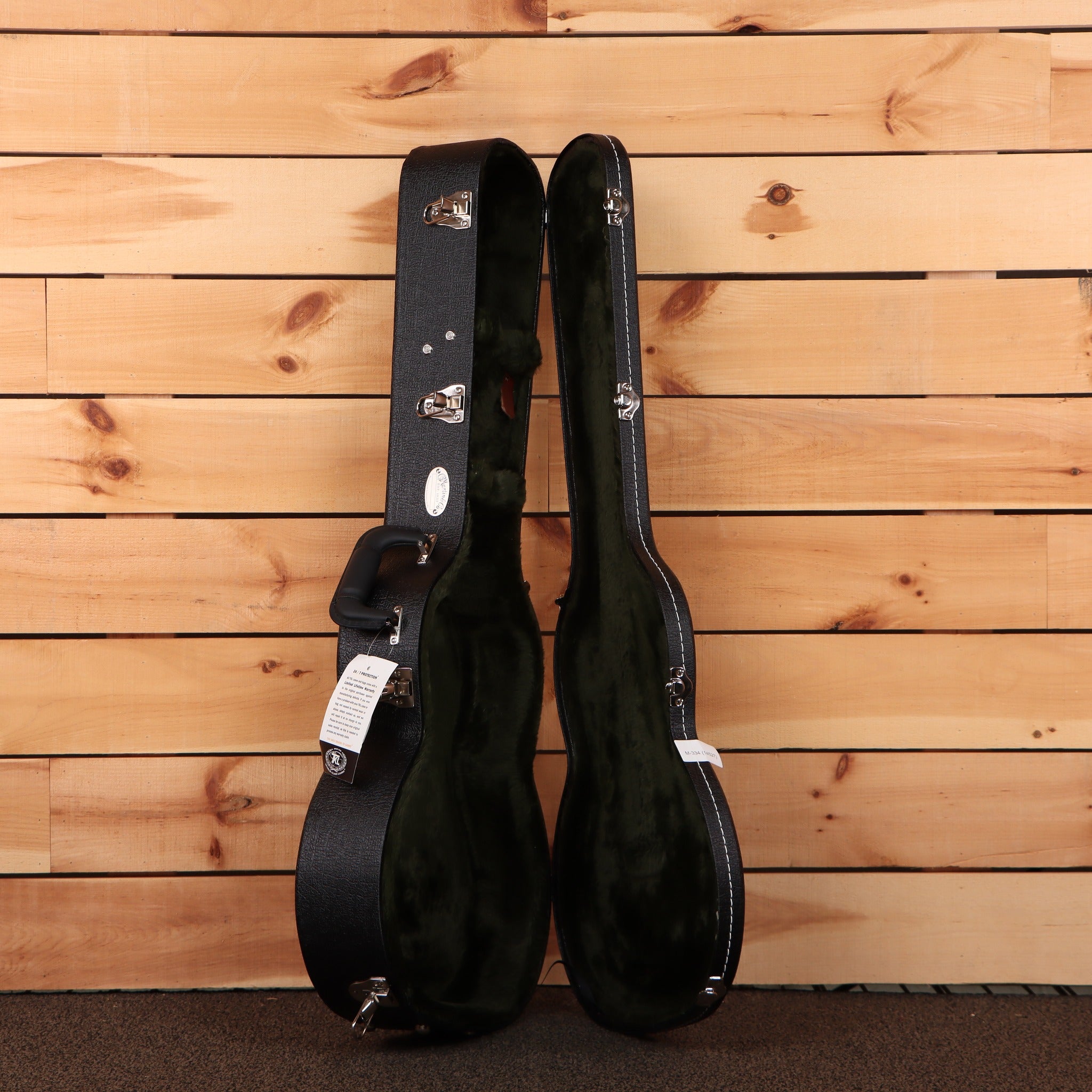 Martin 0-17 Dark Mahogany hardshell guitar case open black exterior green plush interior with silver latches