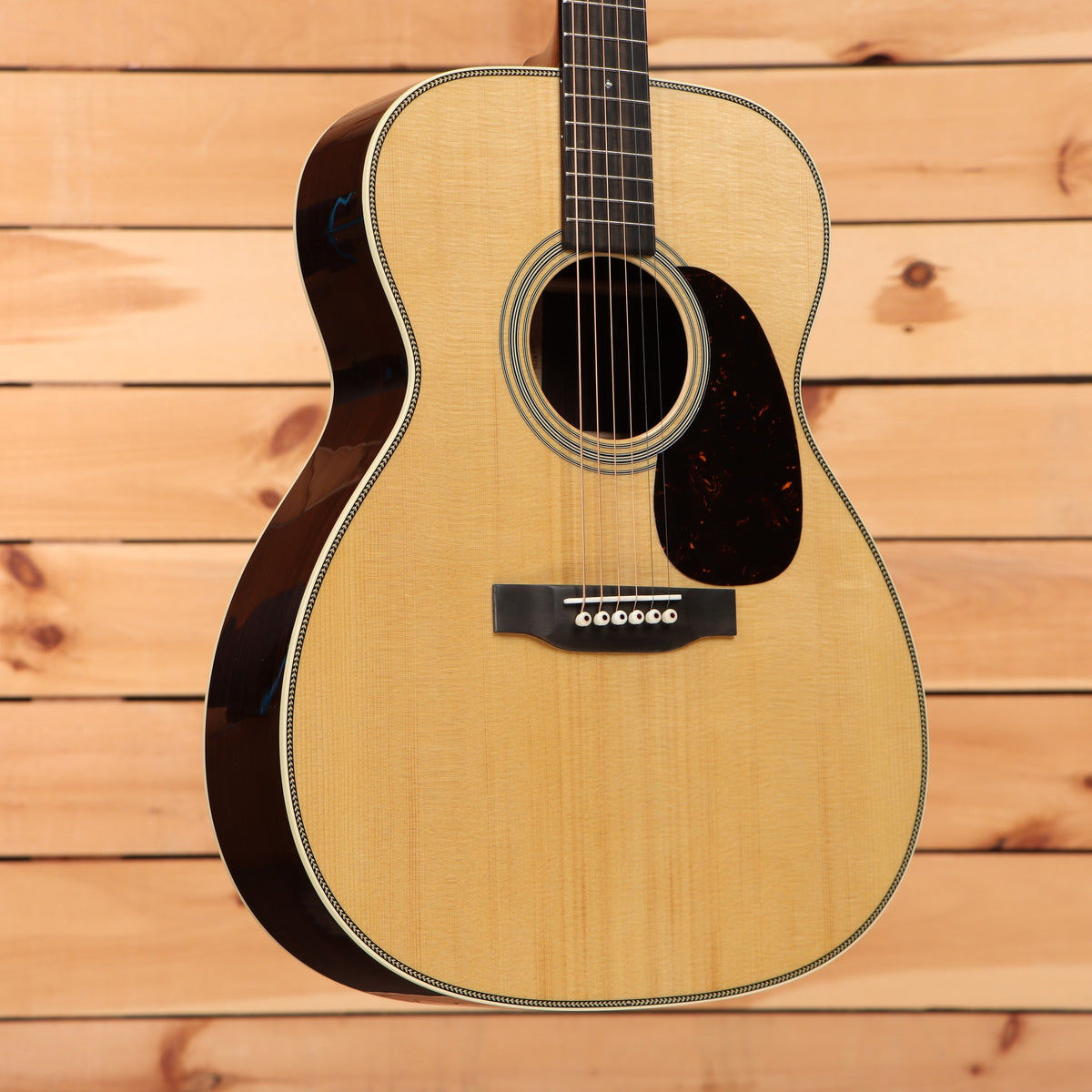 Martin M-28 acoustic guitar Aging Toner finish with herringbone body binding and tortoise pickguard
