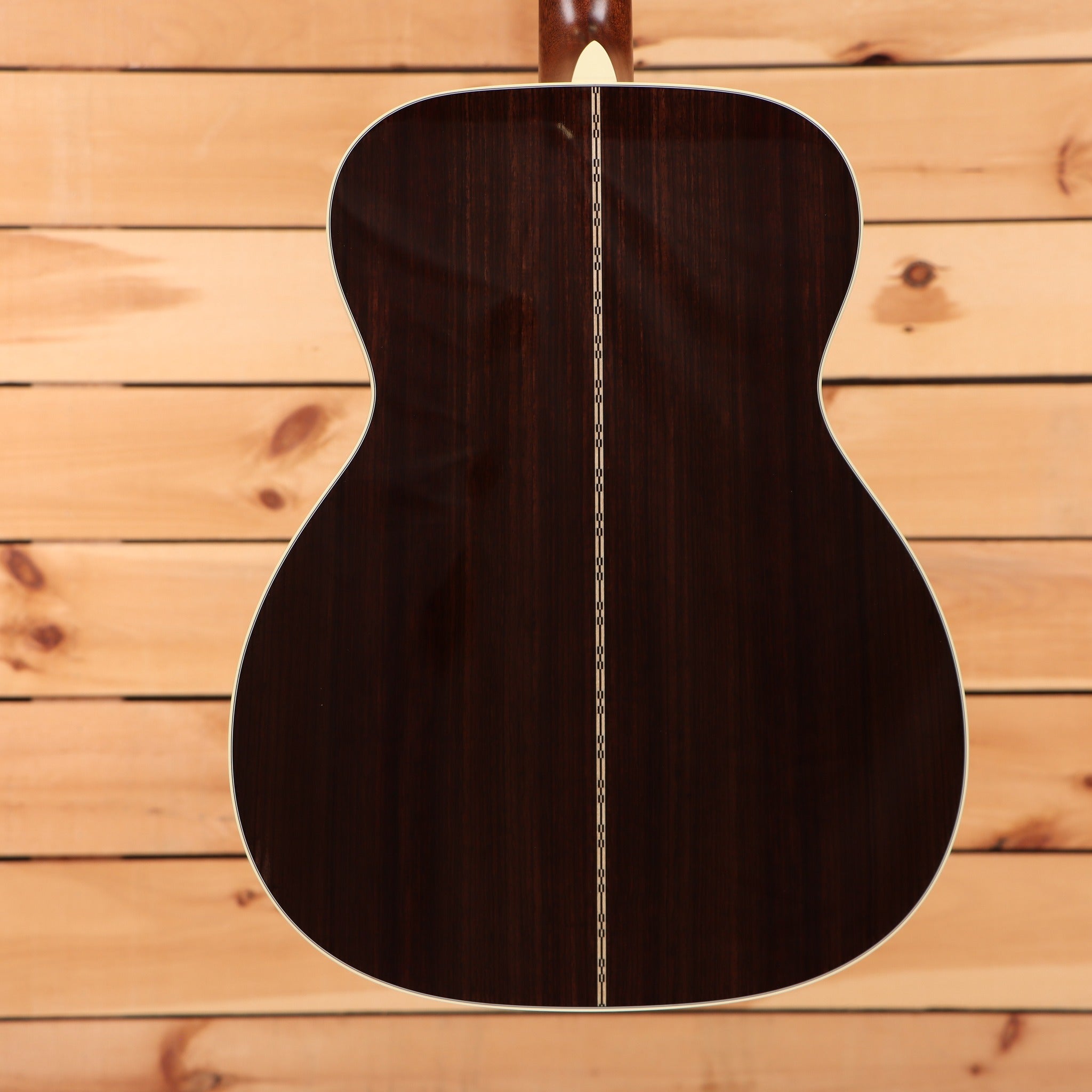 Martin M-28 Aging Toner acoustic guitar with Indian rosewood back featuring decorative center seam inlay and white binding