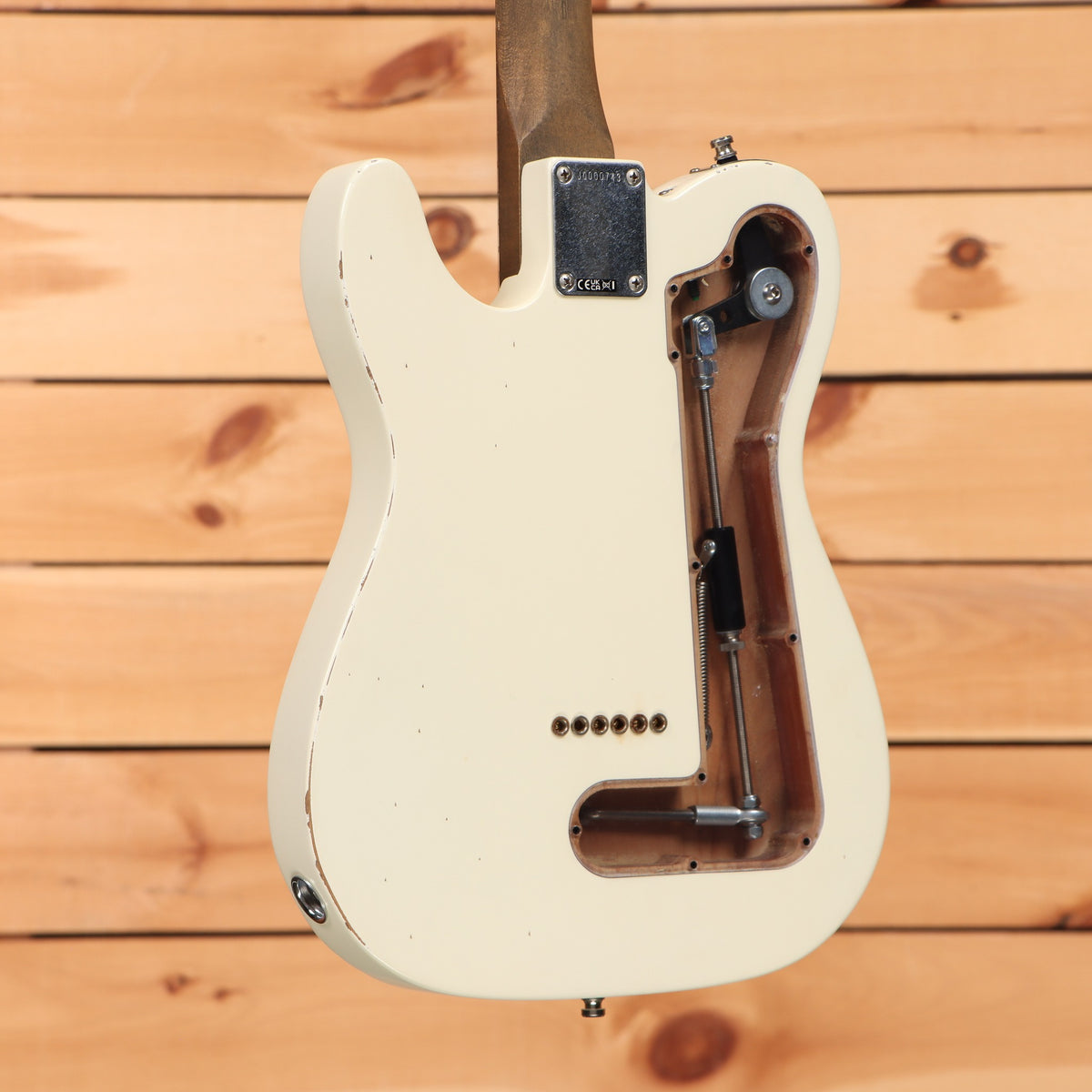 Fender John Osborne Telecaster electric guitar Olympic White relic finish with tremolo spring cavity back view