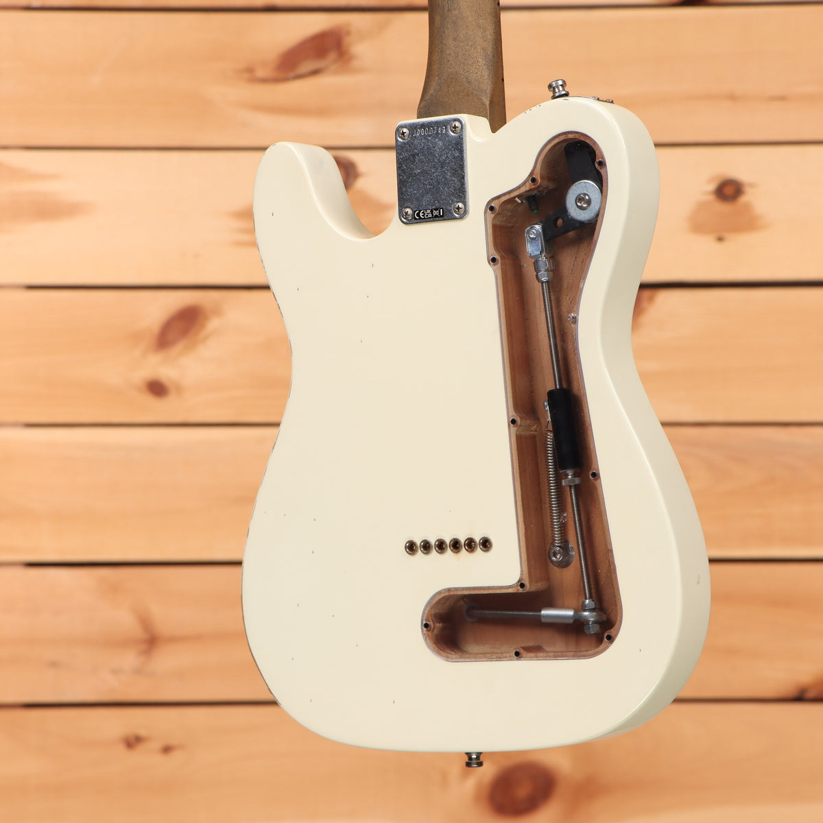 Fender John Osborne Telecaster electric guitar Olympic White showing rear tremolo cavity and aged rosewood neck