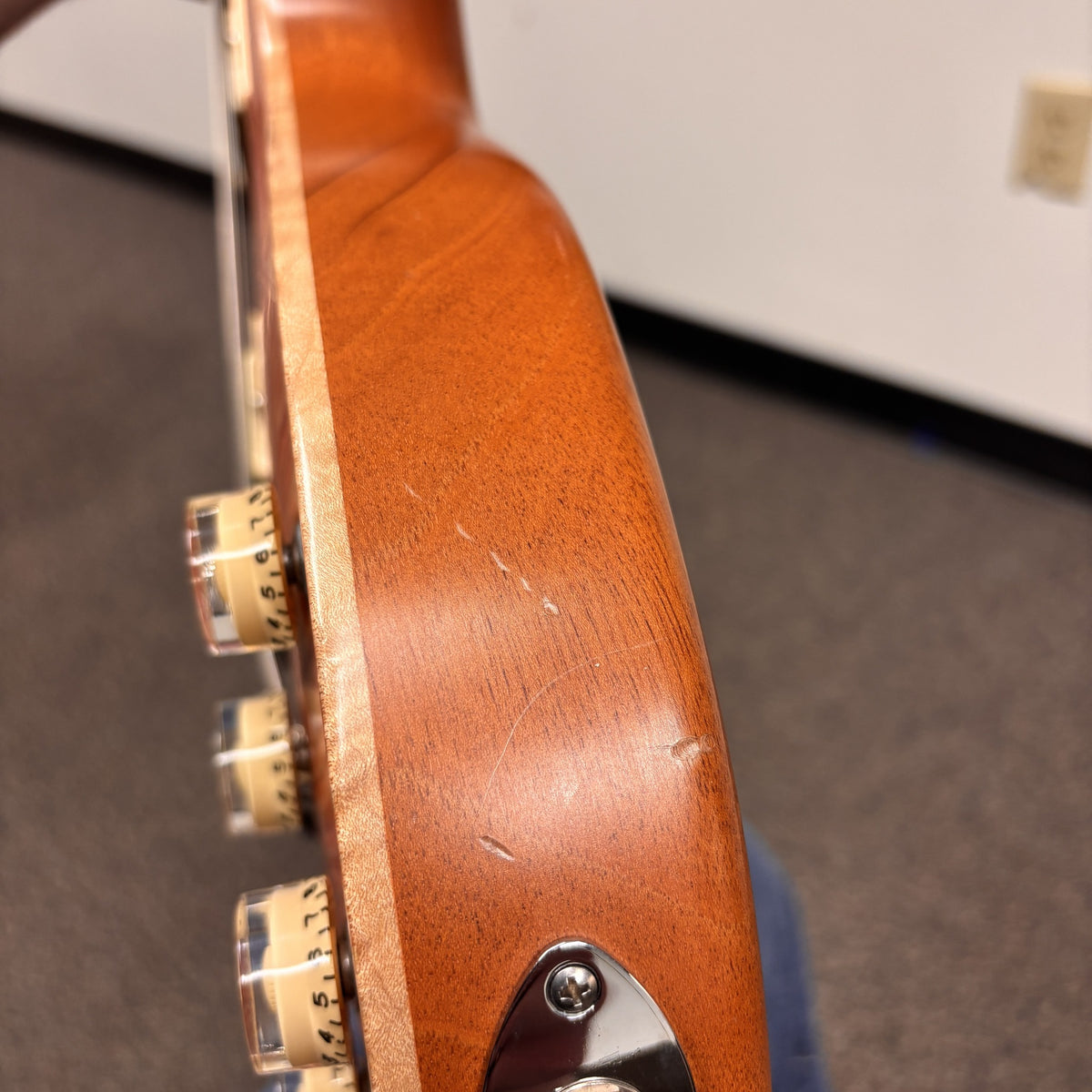 Tom Anderson Bulldog electric guitar Satin Natural Red showing mahogany neck back with chrome tuners